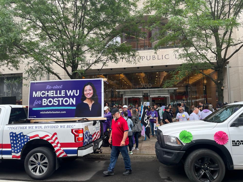 pickup with big Wu signs stuck and bunch of people wearing cool purple Wu tshirts