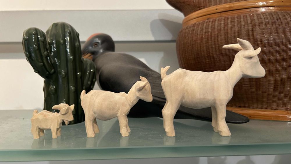 hand-carved wooden goats
