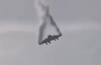 Still pic from video showing smoke, or possibly fuel pouring from the wingtips of the wings of a Turkish Airforce C130 cargo plane falling from the sky
The straight leading edge with engines and propellers attached rotating about it's centre of balance has the entire front fuselage sheared off at the leading edge of the wing, a small stub of aft fuselage protrudes from the trailing edge, all of the rest of the aft end is gone.
The engines appear to be unharmed, but something appears to have blown out both wing tips, possibly releasing fuel from the wing tanks. The fact that there is no apparent fire argues for a catastrophic failure around the wing box
This is a VERY weird event