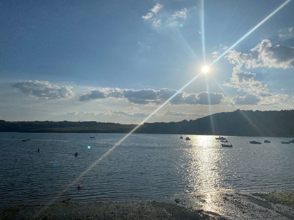 Sun setting over sea