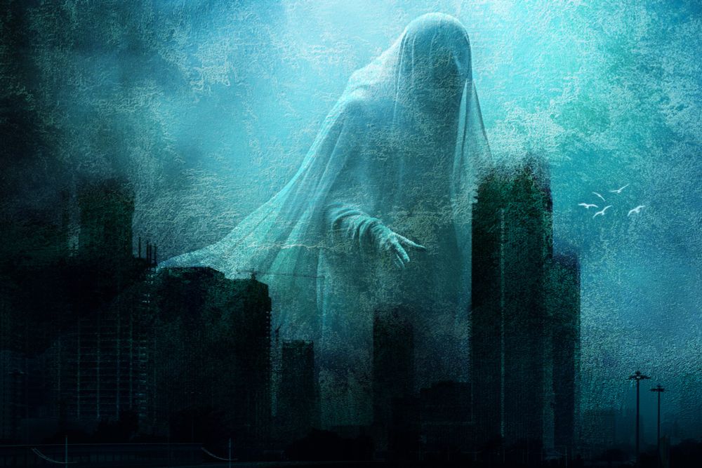 A ghostly apparition towers over a cityscape engulfed in mist, blending seamlessly with the surrounding skyscrapers. The atmosphere is eerie, enhanced by shades of green and blue, and gives the impression of a haunting presence.