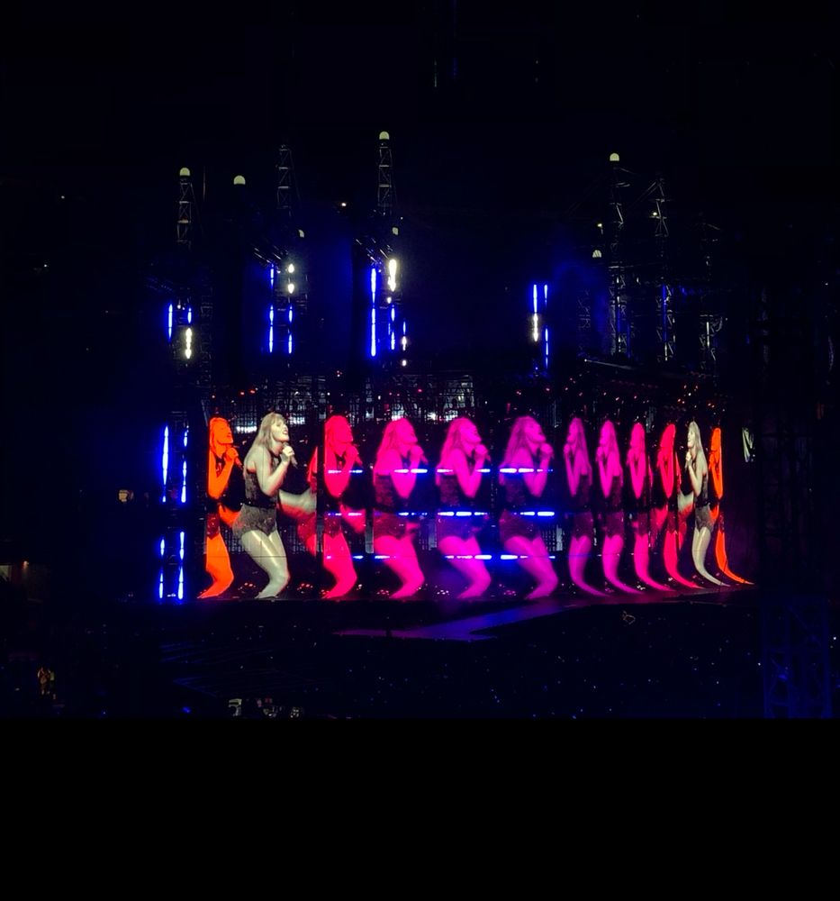 reputation stadium tour visuals during “blank space” - pink orange and white multiples of taylor swift performing live on screen 

(taken July 10, 2018 at Washington Commanders Stadium)