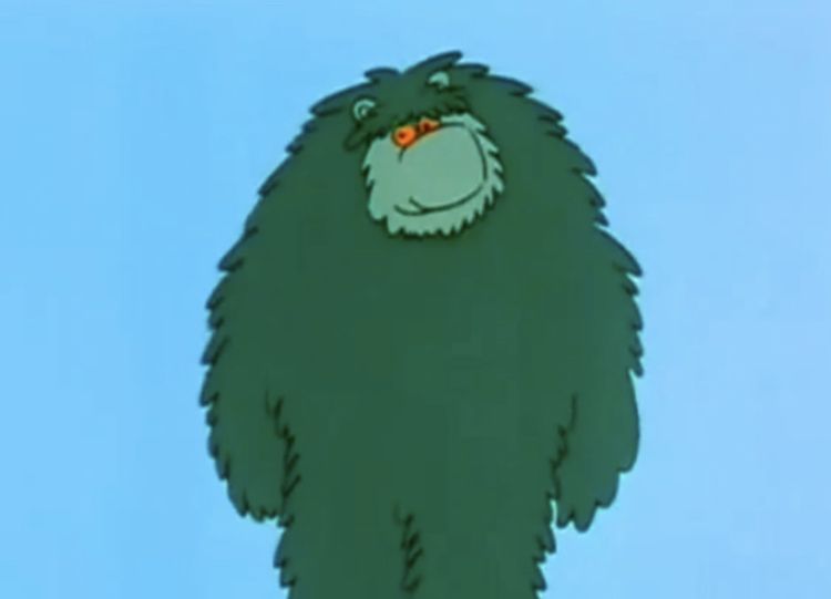 Big Muzzy, a green bear-like creature who can either teach you a new language or devour you whole in a matter of seconds