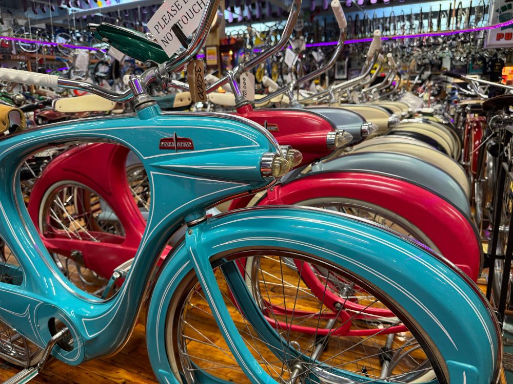 A row of very stylish Bowden bicycles in different colors.