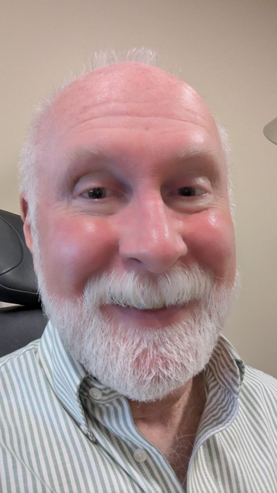 Old guy mugging for the selfie with highly dilated pupils making him appear more psychotic than usual.