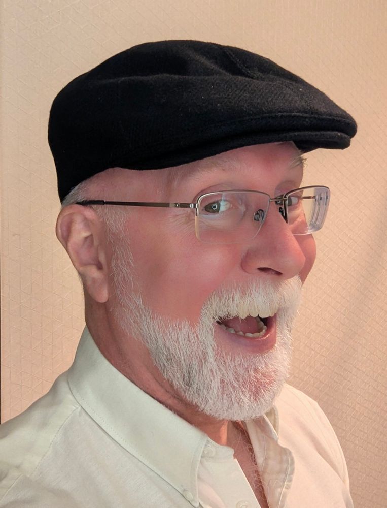 Old guy is mugging for the camera in a selfie while modelling his faaaaabulous new black Goorin Bros' 100% wool "Ronald Amos" flat cap. 