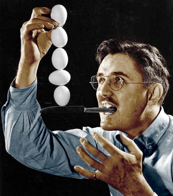 The Egg Man! but in colour. hes got a knife in his mouth and hes balancing 5 eggs its pretty cool