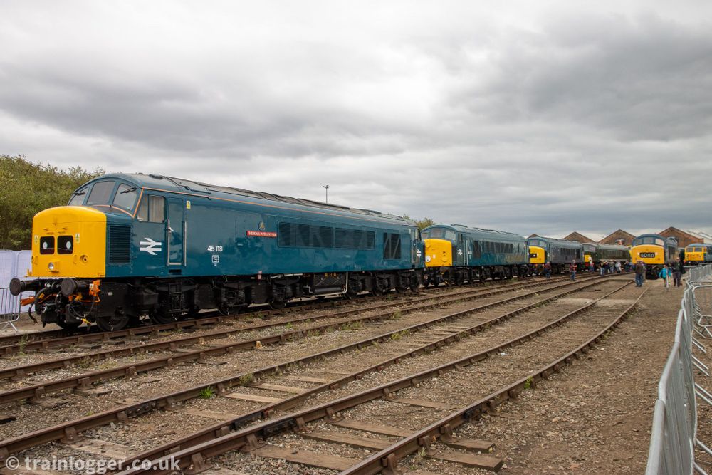 a scene featuring five classic locomotives with distinctive protuding noses