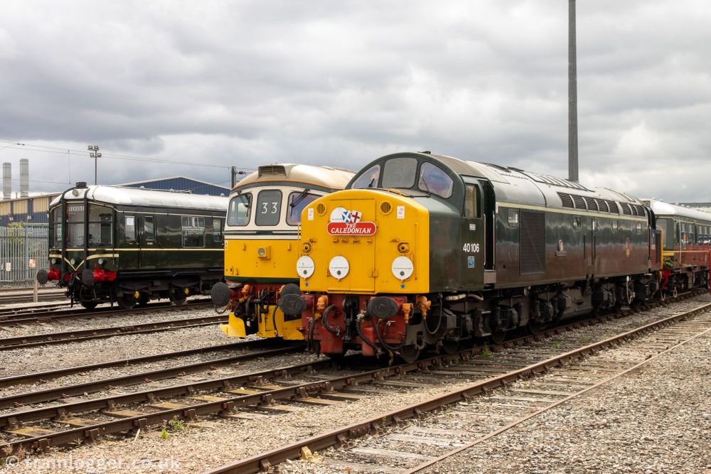 two green locomotives and a green railcar