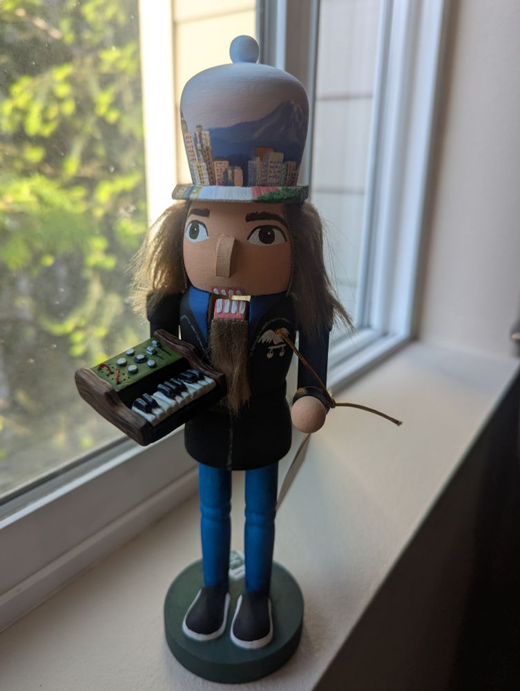 The front of a nutcracker painted like Restless Mosaic from his music video.