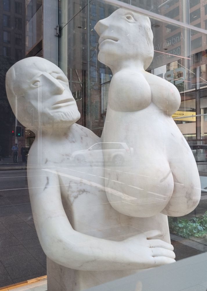 Marble(?) sculpture of a man holding a curvy woman, found in Perth CBD.