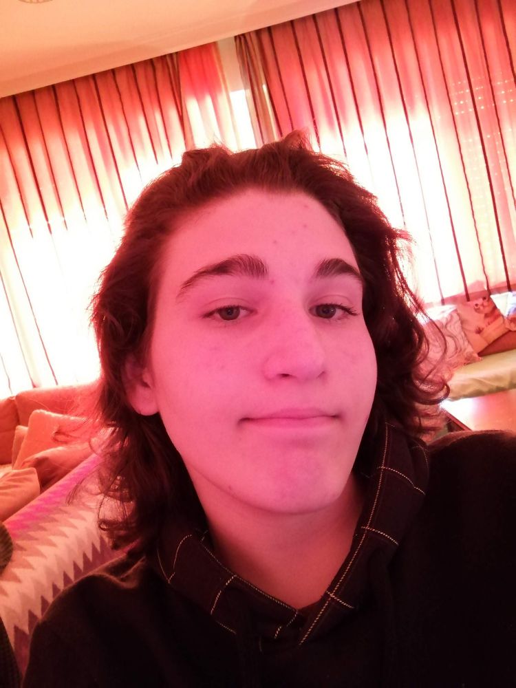 A picture of me in 2020 where the lighting made it appear as if the background is pink