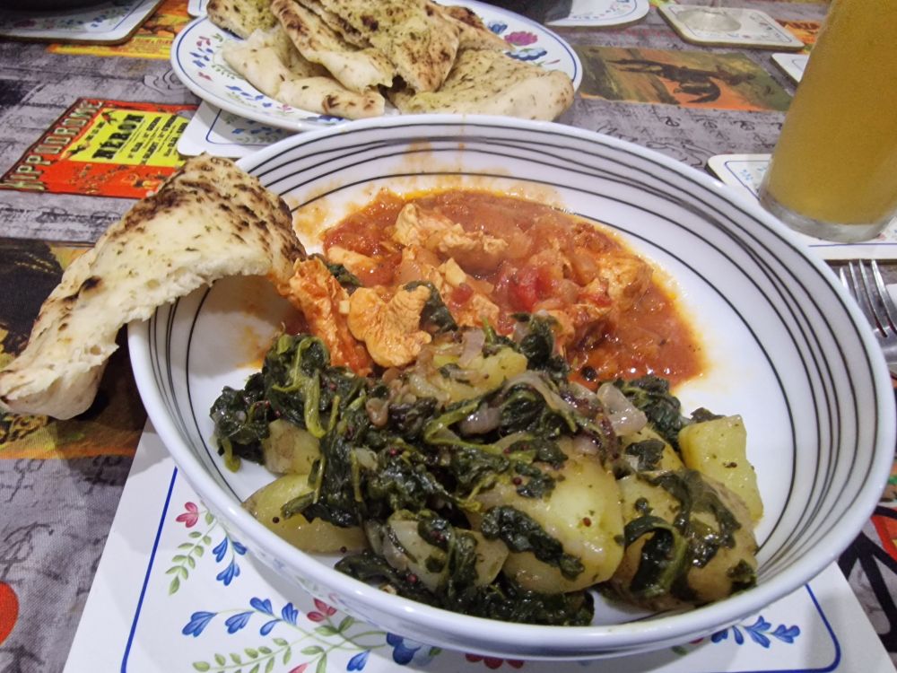 Chicken with tomatoes and garam masala, sag aloo, naan 