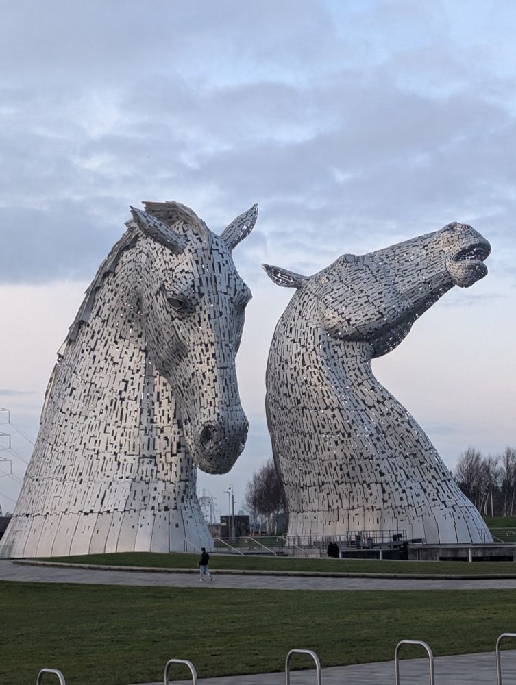 Two metal horse head sculptures 