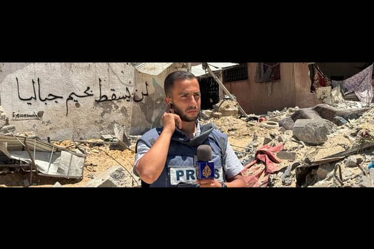 Al Jazeera journalist Anas al-Sharif in bullet-proof PRESS vest reporting from ruins in Gaza