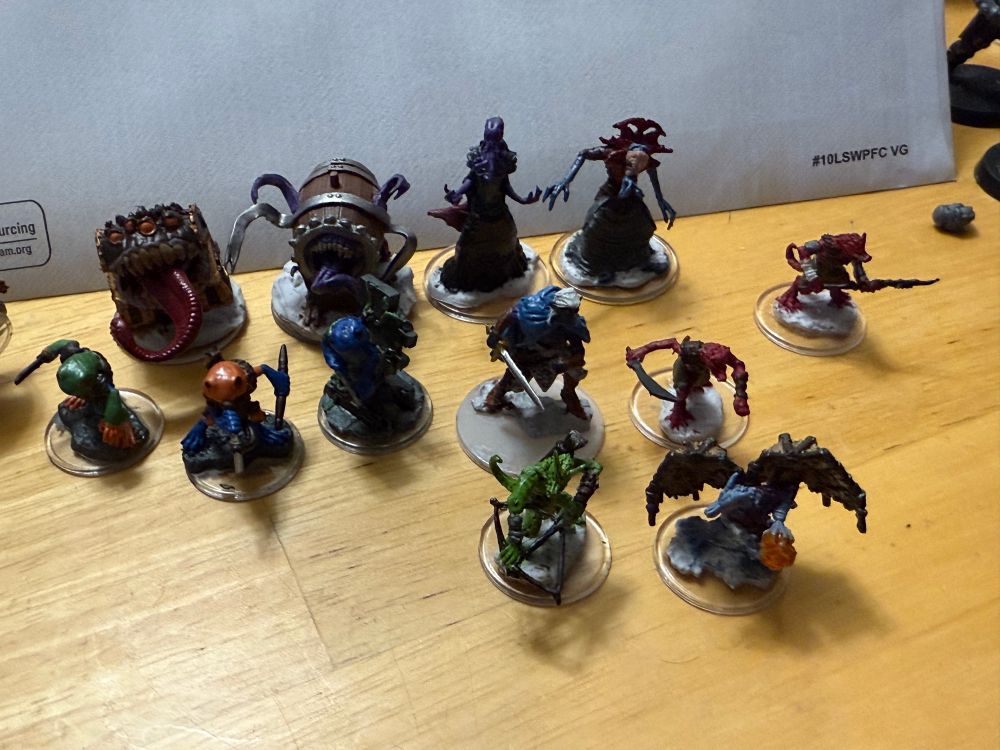 Closeups of two mimics, two mindflayers, a Drow, three Grugs, and four Kobolds. 