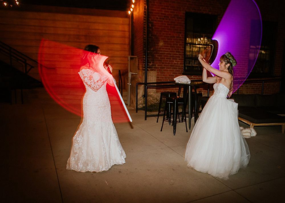 Brides fight with light sabers 