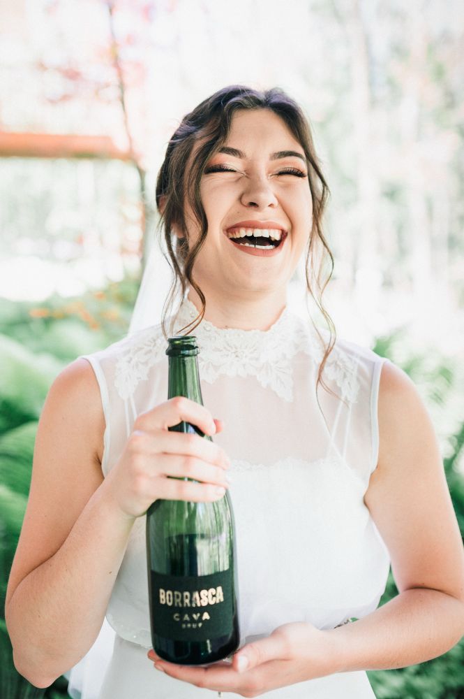 Bride with a bottle of champagne 