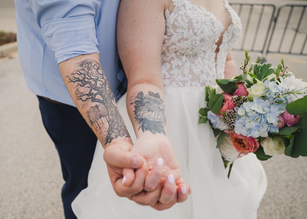 Bride and groom with their coordinated, tattoos