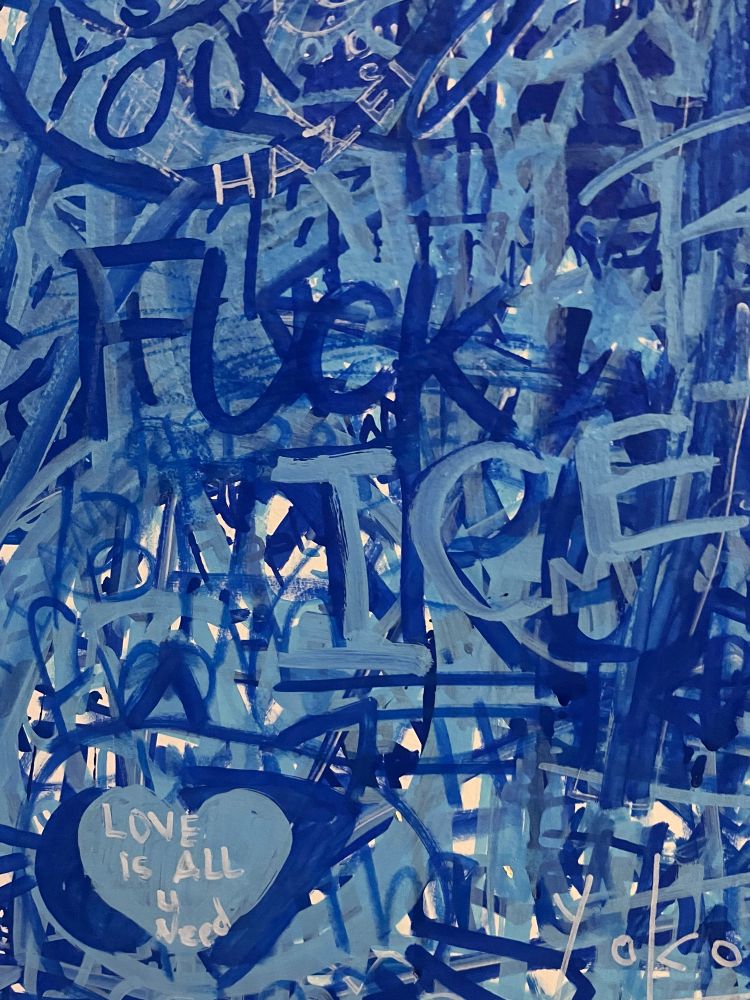 writing on a wall saying “fuck ice”