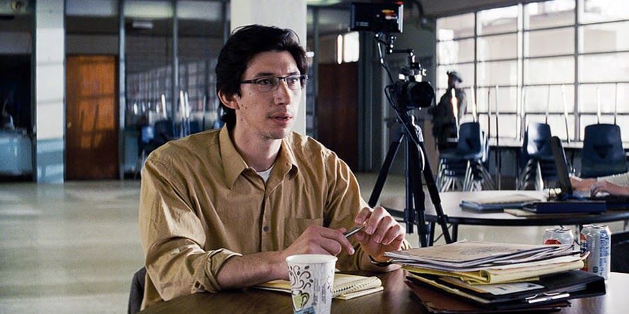 Adam Driver as Paul Sevier with a cup of coffee doing witness interviews