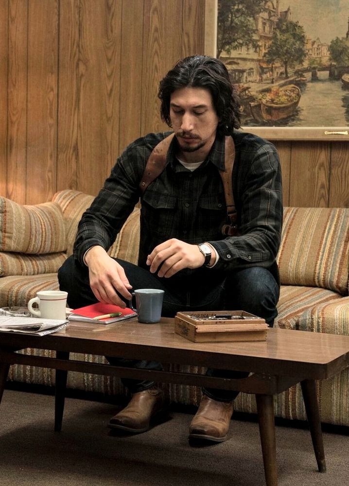 Adam Driver as Flip in Blackkklansman dwarfing a coffee table and some small coffee mugs (his hand is larger than the cup 😳)