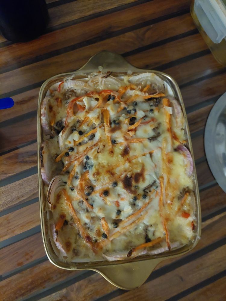 Vegetable bake that my mom made: Onions, carrots, tomatoes, pumpkin, cheese, olives, and bechamel I think!