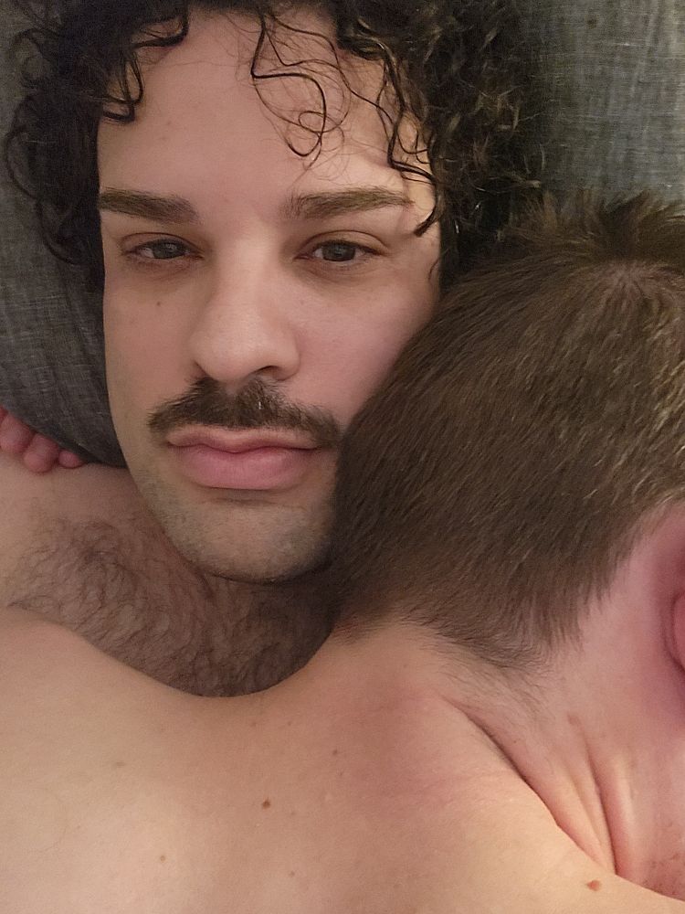 Naked boys embracing