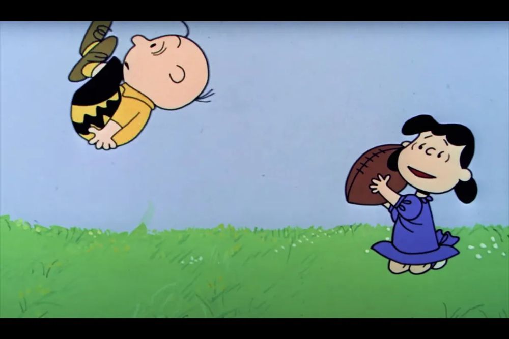 Lucy pulls the football out from Charlie Brown