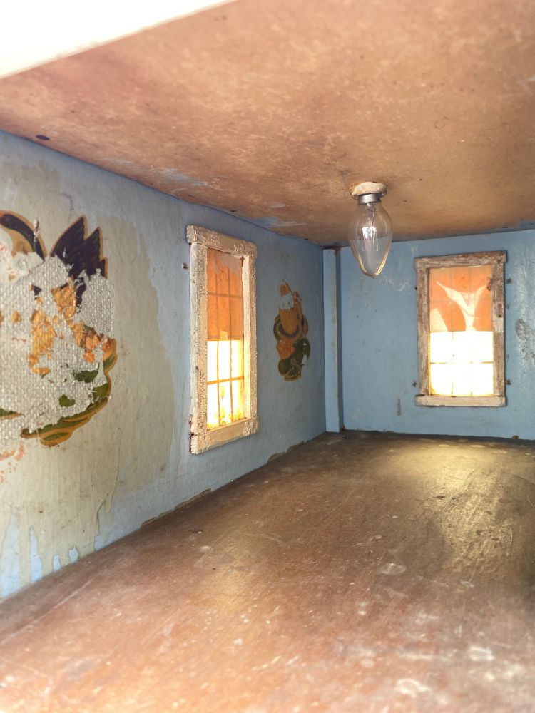 Here’s what I would assume was the nursery it has some of the original decals they composed on it left over in both of the rooms just beautiful. A large portion of the walls are made of this old cardboard, which was like an early MDF particleboard before 1950.