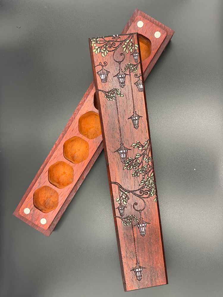 Wood dice vault for a set of 7 with a minimally painted hanging lantern motif