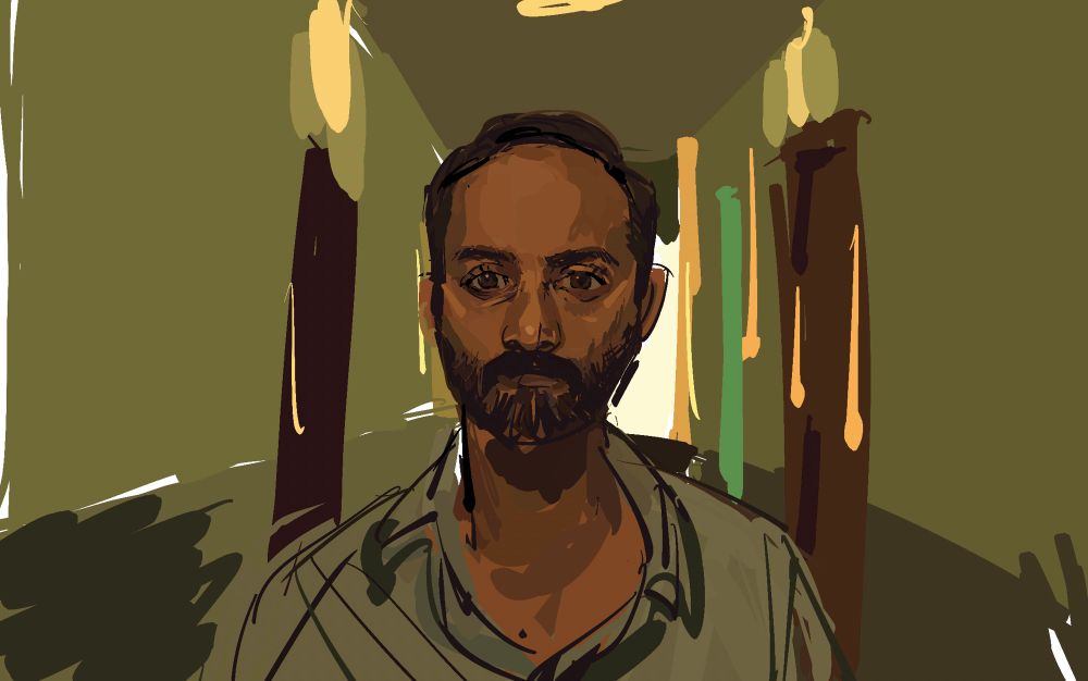 Amar in corridor, face frowning.