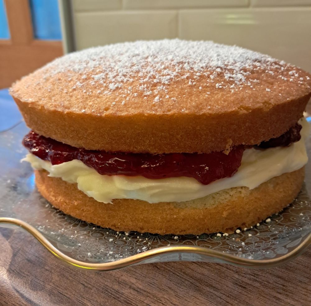 A Victoria sponge cake. Lashings of buttercream icing and a smidge of strawberry jam (who am I kidding, there's loads of jam) 