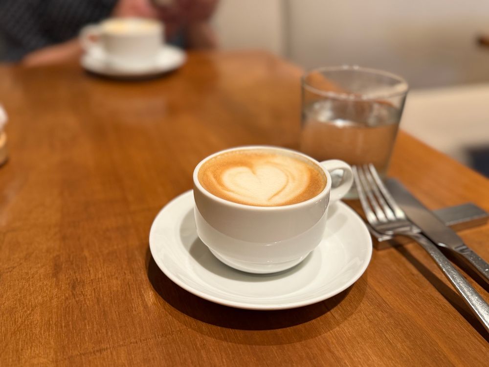 a latte with heart shaped latte art