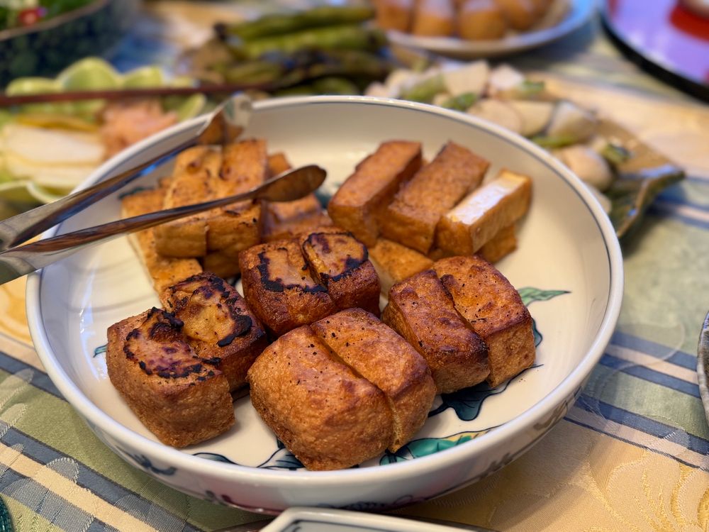 two kinds of fried tofu regrilled, half with homemade shiromiso 
