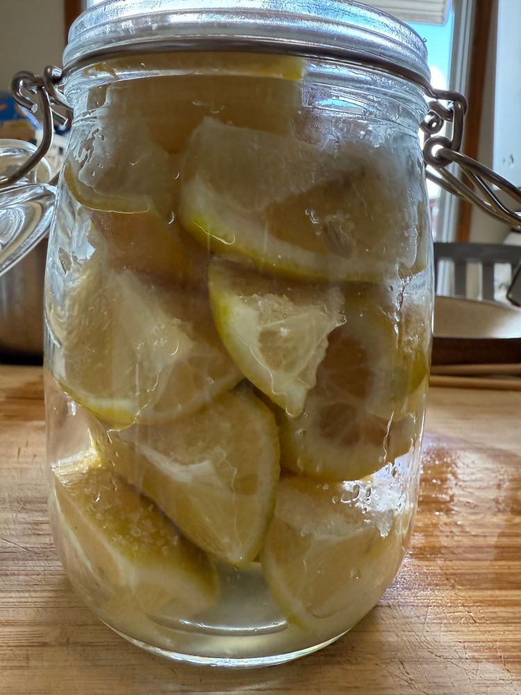 side view of the lemon wedges in a glass jar