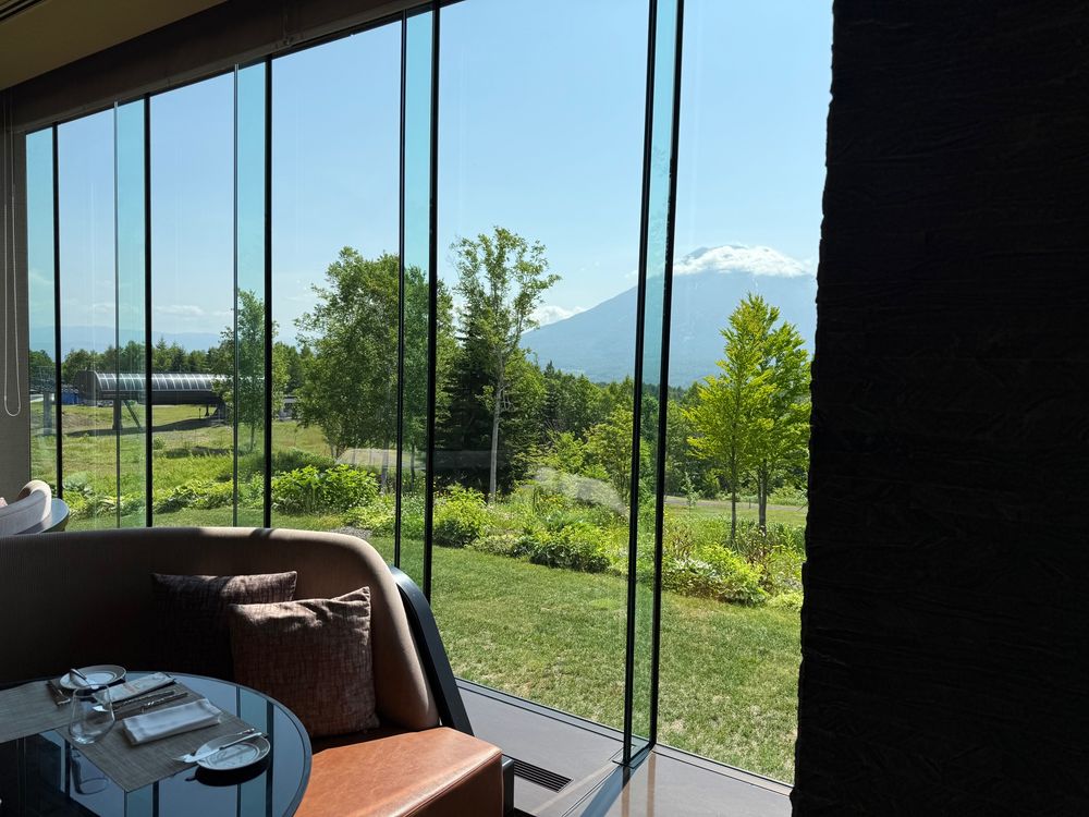 a dining room with a view of a mountain