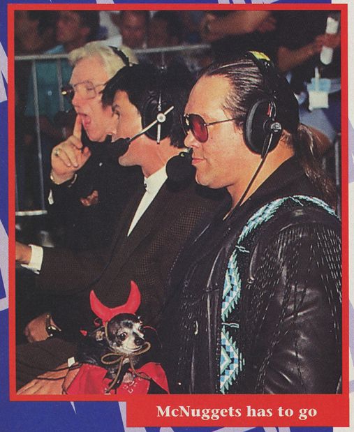 screenshot from an issue of wcw magazine featuring a photo of steve "mongo" mcmichael holding pepe in a devil outfit, seated next to eric bischoff and bobby "the brain" heenan, this is from a section titled "brain reaction" and features a caption of "McNuggets has to go" from heenan 