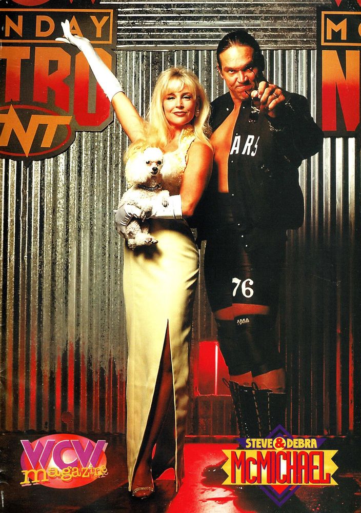 wcw magazine full page photo of steve "mongo" mcmichael next to debra mcmichael holding her poodle ditka, who is wearing a black studded collar 