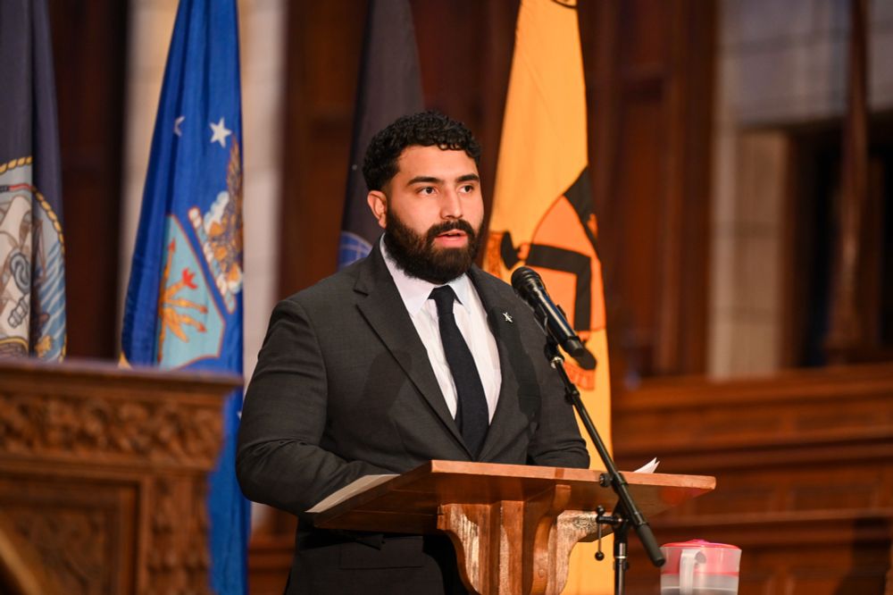 Ramon Espinoza speaks at a podium