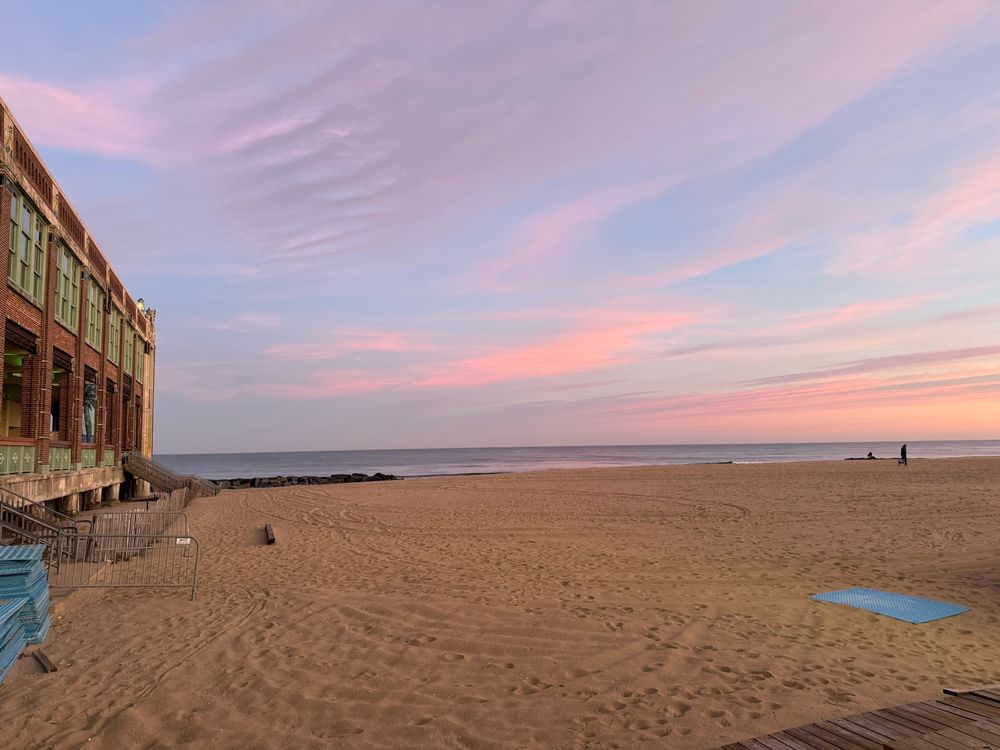 The Asbury Park beach with pink clouds above it