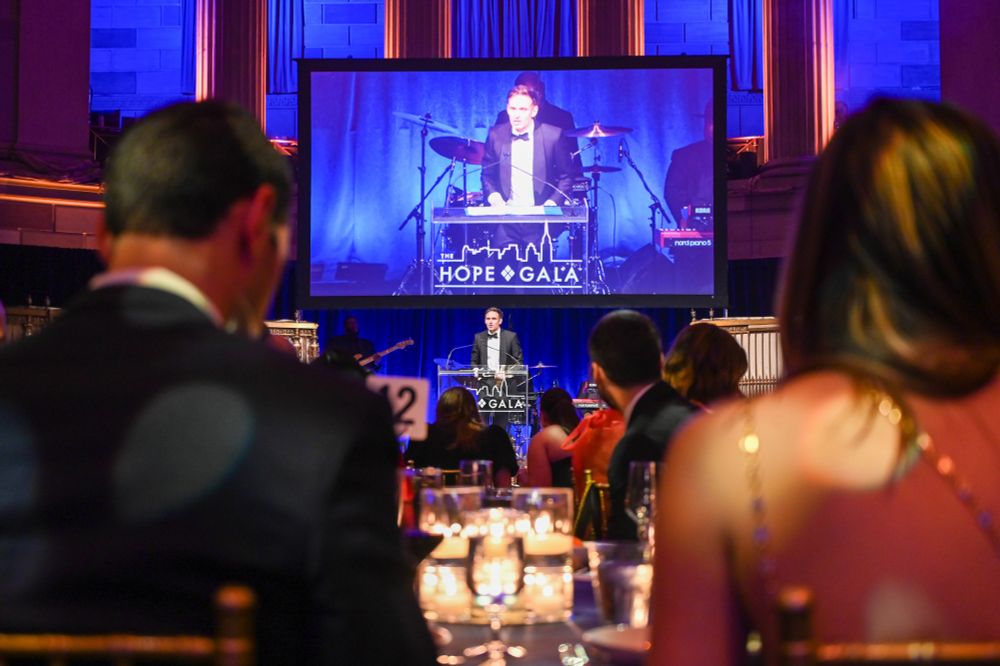 Ryan McGarry speaks on stage
