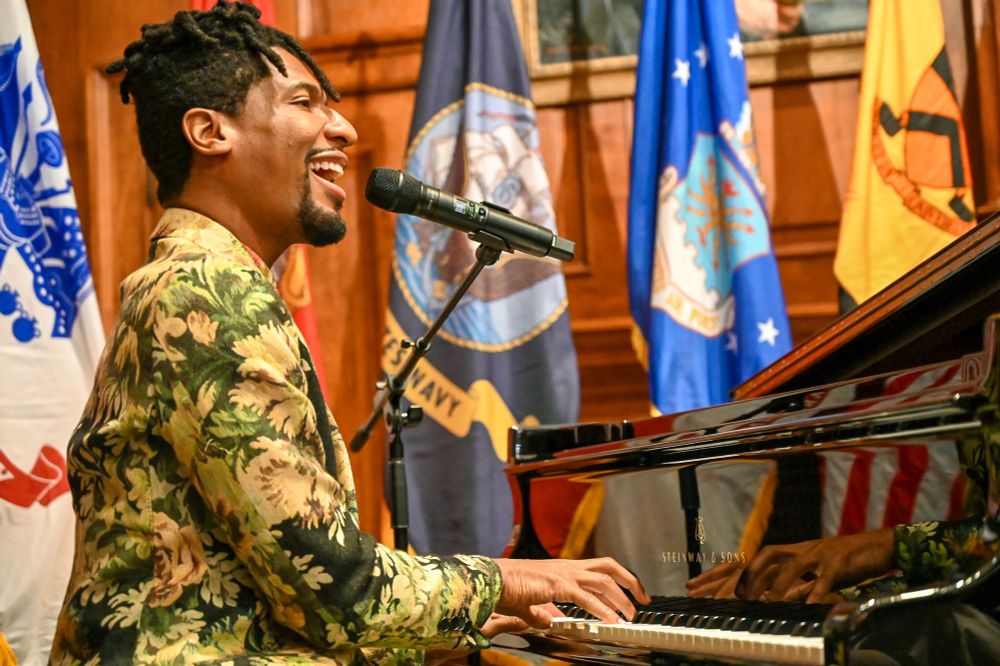 Close up of Jon singing and playing piano