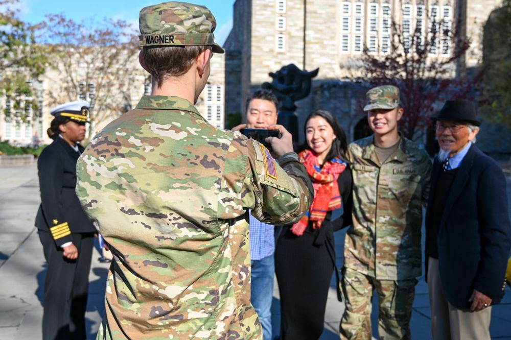 ROTC student takes a picture with their family