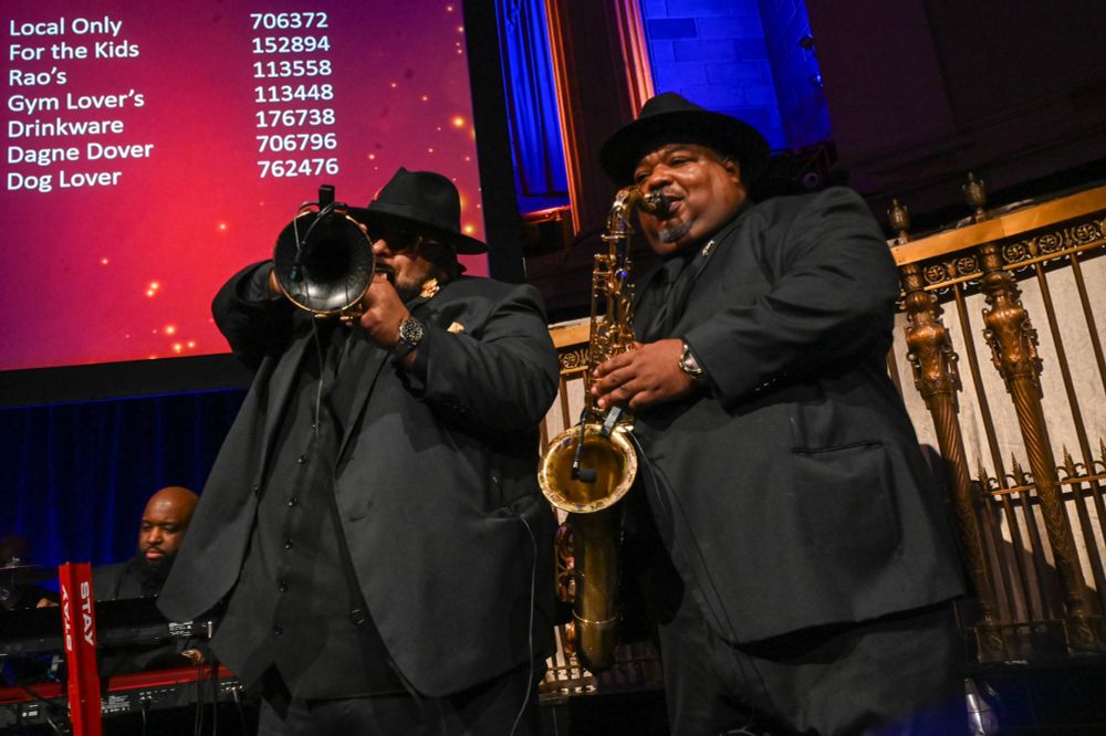 Trumpet player and saxophonist from Rare Vintage play on stage