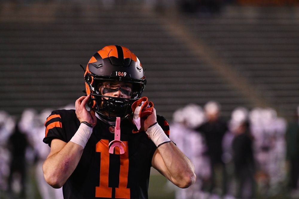 Aiden Besselman adjusts his helmet