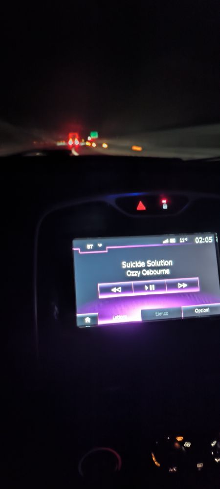 A blurry photo of the car's radio playing "Suicide Solution" by Ozzy Osbourne, taken irresponsibility at 2 AM while driving on the highway.
(This post was written an hour later, from a gas station).