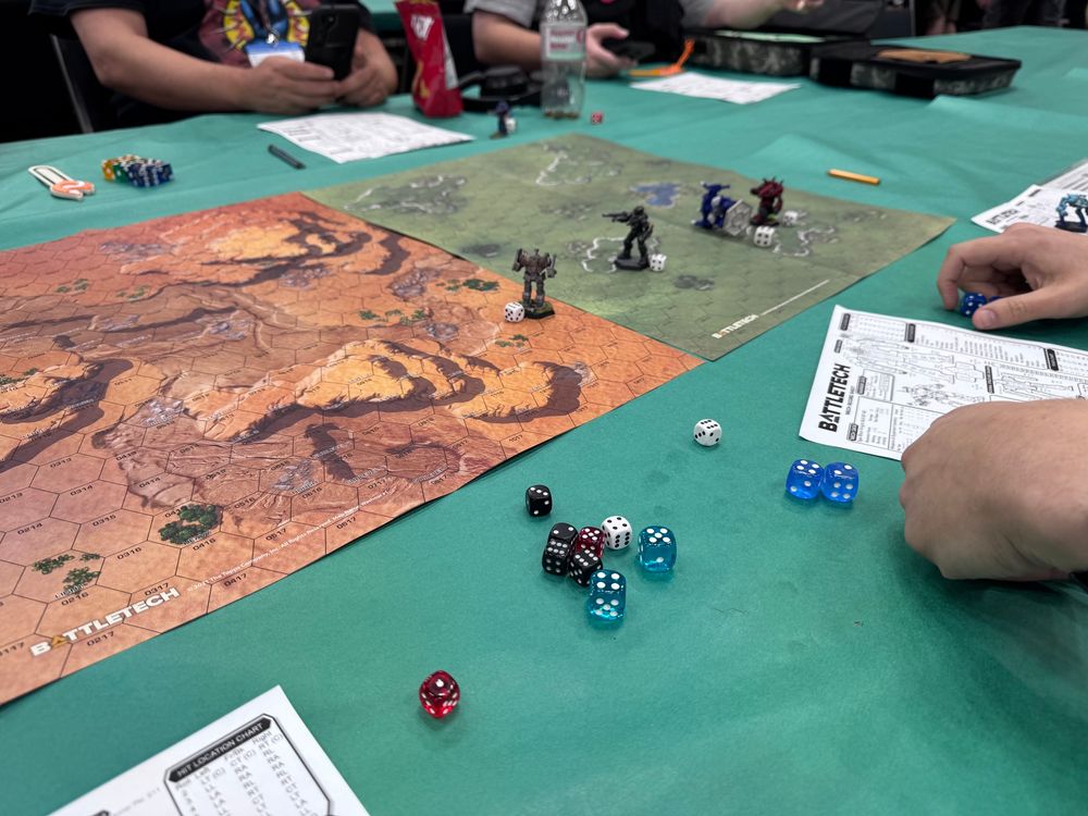 The Battle tech game board shows four giant robots yet standing, though two would not be for much longer. The Mechs all have fantastic paint jobs, which greatly enhanced the game. 