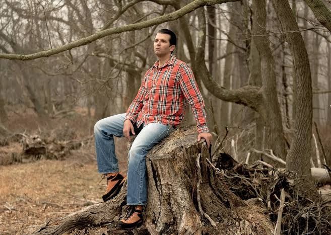 Donald trump jr in everyman cosplay sitting on a log