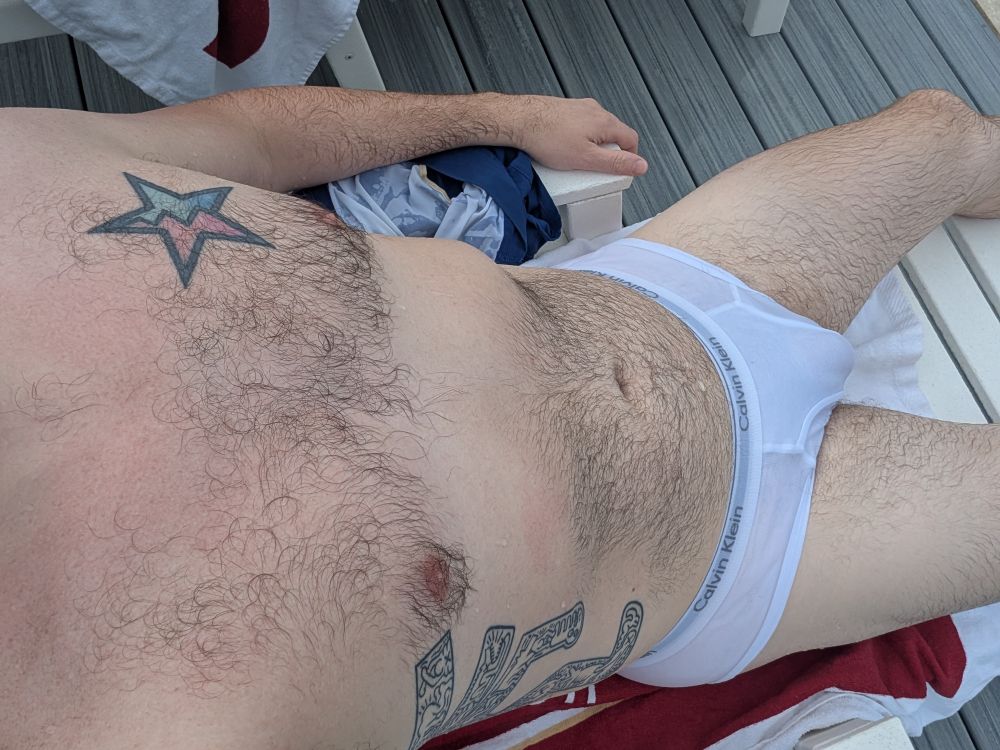 pic of my laid out poolside on a deck chair in wet Calvin Klein tighty whities